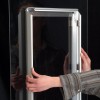 Snap frame mounting on display window