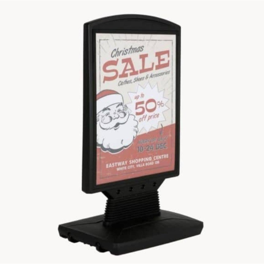 Spring-loaded pavement sign | Flexible design