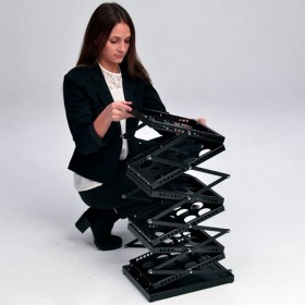 Black folding brochure holder accordion-style open with user