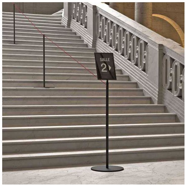 LINE black poster frame in stairwell with room 2 signage