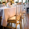 White traditional design chairs in reception setting