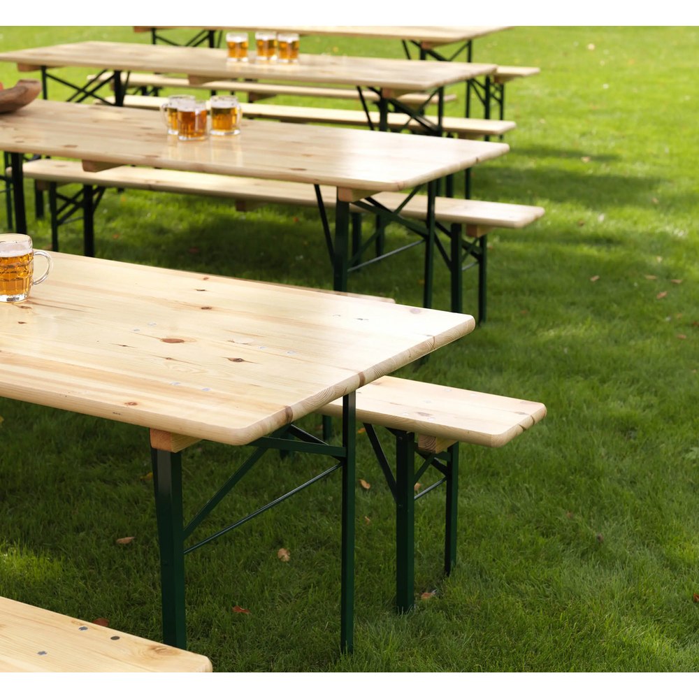 Wooden brewery bench with green steel frame in use