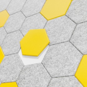 HEX akusztikus fali panel szürke és sárga, dombornyomott hatszögletű csempék közelről