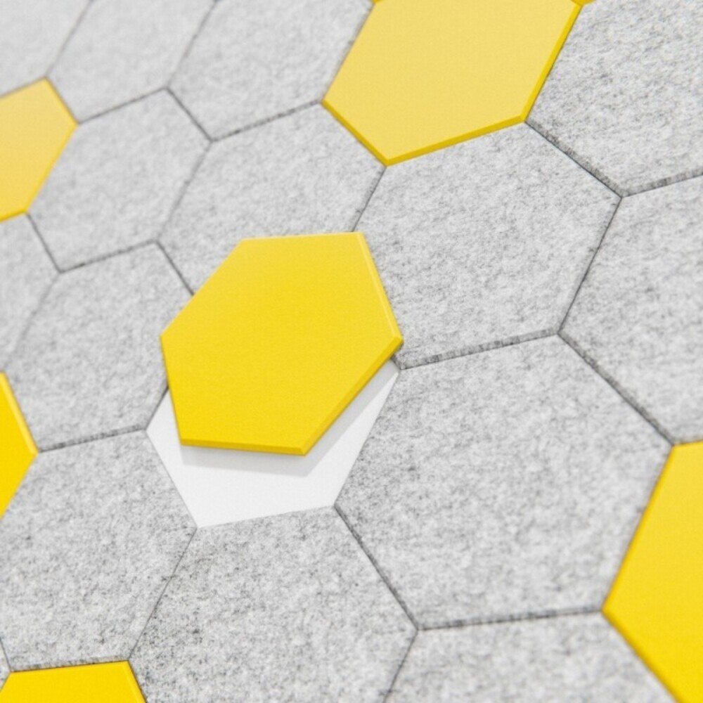 Panel acústico mural HEX gris y amarillo, detalle de losetas hexagonales
