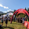 Red and white inflatable promotional tent Compressport at mountain sports event