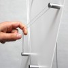 Close-up of the clear A4 pockets with anodised aluminium spacers and transparent rings.