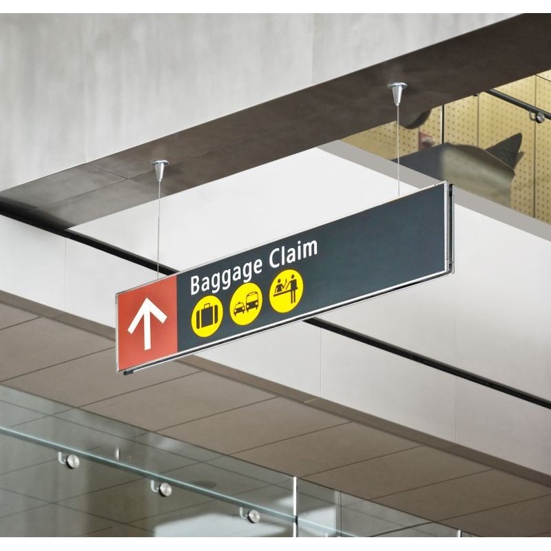 Double-sided hanging directional Signcode® signage in a public hall