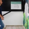 Signcode® Slim magnetic wall display panel mounted high with an office directory plate