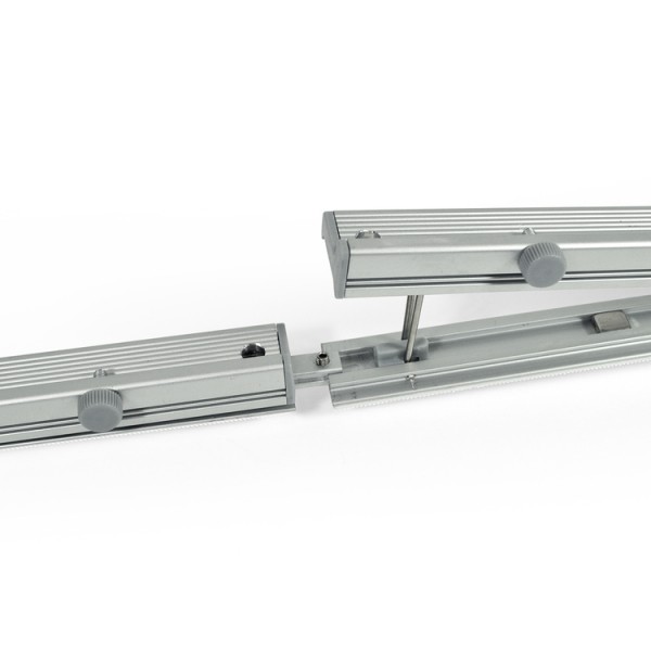 Two wall profiles being joined with the connecting tab
