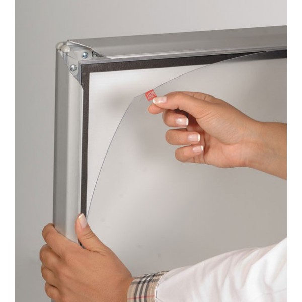 WindPro pavement sign removing protective film from snap frame