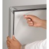 WindPro pavement sign removing protective film from snap frame